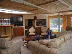 Patio area where one can watch TV have a Braai or light a fire on a chilly evening