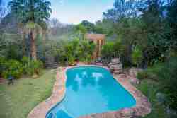 Executive /honeymoon cottage with an upstairs bedroom overlooking the pool