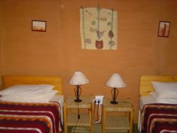 Twin bedroom in Mojaki Cottage