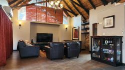 Main lodge lounge with DSTV and library