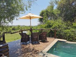 One of the dining tables next to the swimming pool