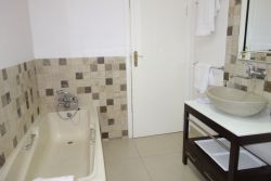 Seabreeze unit bathroom with shower, bidet and bath.