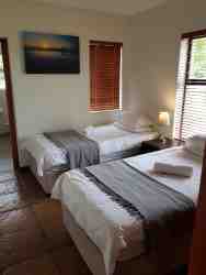 Second bedroom featuring two single beds