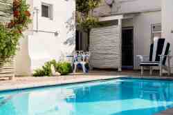 Die Opstal enclosed swimming pool area for all the guests staying at Die Opstal.  