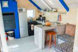 Die Opstal Top Loft apartment,  sleeping one couple, or two persons, kitchen and inside braai/fireplace.  Leading directly to terrace with a sea view