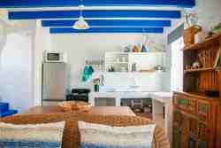 Die Opstal Thatch Apartment,  sleeping one couple, or two persons, is a duplex apartment.  Bedroom and bathroom is upstairs.  Direct access to the swimming pool where the Thatch braai area is as well.