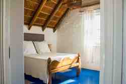 Die Opstal Thatch apartment bedroom, sleeping one couple, or two persons, upstairs with bathroom.  