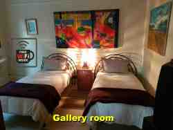 The Gallery room.  2 single beds, full aircon, full satelite TV and bathroom with shower inside the room