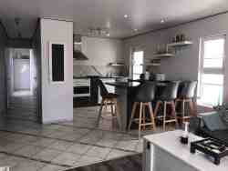 Quay West Holiday Home - Interior - open plan kitchen/dining/lounge