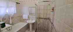 Room 5, Bathroom
Bathtub and a shower
