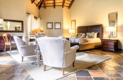 Re a Lora Lodge - Bedroom 
 with Tv and en-suite Bathoom, set up with King Size Bed. 