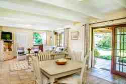 Spacious dining area and lounge with sliding door to patio area.