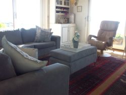 Sunny large comfortable lounge with large flat screen TV/all channels DSTV & stereo sound.