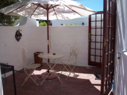 Pretty private courtyard of Studio with French Doors to cosy accommodation.