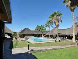Sparkling pool, tennis courts and ice cold Windhoek Lager!