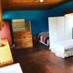 Family suite, separate from main building. Private bathroom and kitchen. Room setup for 4 but extra bed can be added to fit 5 guests