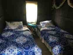 Basic private cabin Twin/Double. The two twin beds can be pushed together to make one large double. This cabin is situated further away from the main building for a more relaxed and quiet atmosphere. Access to Communal bathrooms and kitchen facilities.