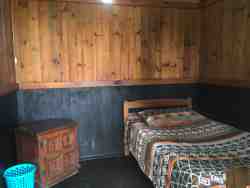 Private single cabin.This cabin is situated further away from the main building for a more relaxed and quiet atmosphere. Access to Communal bathrooms and kitchen facilities.