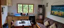 Cottage 3 - open plan kitchen & living area with double sleeper couch