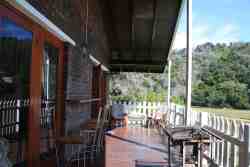 Cottage 4 - upstairs , front pation and entrance with braai facilities
