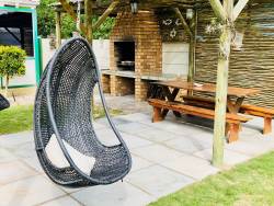 Swing chair at braai area outside