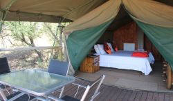 Tented Chalets - TENTED CHALETS – Springbok (Unit 1), Impala (Unit 2), Waterbuck (Unit 4) and Sable (Unit 5)
Savannah has 4 Tented Chalets.  Each Tented Chalet has an en-suite bathroom with a shower, toilet and basin.  There is a King Size Bed OR 2 single beds.  An additional bed can be added for children or a 3rd guest.  Our Tents are built on a solid structure raised off the ground. This gives you a great view of the African Bushveld and the Vredefort Dome.  
Each Tent has its own deck with comfortable chairs and a table to enjoy a cold sundowner from our fully licenced bar. All units are equipped with a coffee/tea station and electric blankets.  It includes all bedding, towels and amenities. 
All room rates include breakfast.  Menu’s for lunch and dinner available.  
SELF-CATERING OPTIONS - Braai areas are available.  You are more than welcome to bring your own braai meat, charcoal, fire lighters and salads.  We will keep your food cold in our fridges.  Cutlery and Crockery will be provided.  No Alcohol allowed onto the premises.
