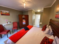Lodge Room - Nyala Family Room
THE NYALA FAMILY LODGE ROOM has a private outside entrance with an additional children's room.  The room has a King Size Bed that can be made into two Single Beds.  The children’s room has a double bunk.  En-suite bathroom, with toilet, shower and separate basin.  There is a fan, hot blanket, heater, hairdryer, amenities, towels, linen, tea and coffee station.
All room rates include breakfast.  Menu’s for lunch and dinner available.  
SELF-CATERING OPTIONS - Braai areas are available.  You are more than welcome to bring your own braai meat, charcoal, fire lighter and salads.  We will keep your food cold in our fridges.  Cutlery and Crockery will be provided.  No Alcohol allowed onto the premises.
