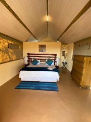 Safari Tented Chalet - Kudu
 TENTED CHALETS – Kudu (Unit 1) and Blesbok (Unit 6)
Savannah has 2 SafariTented Chalets.  Each  Tent  has an en-suite bathroom with a shower, toilet and basin.  There is a King Size Bed OR 2 single beds.  An additional bed can be added for children or a 3rd guest.  
Our  Tented Chalet is half brick and half tent. Built on a solid structure raised off the ground. This gives you a great view of the African Bushveld and the Vredefort Dome.  
Each Tent has its own deck with comfortable chairs and a table to enjoy a cold sundowner from our fully licenced bar. All units are equipped with a coffee/tea station, hairdryer and electric blankets.  It includes all bedding, towels and amenities. 
All room rates include breakfast.  Menu’s for lunch and dinner available.  
SELF-CATERING OPTIONS - Braai areas are available.  You are more than welcome to bring your own braai meat, charcoal, fire lighters and salads.  We will keep your food cold in our fridges.  Cutlery and Crockery will be provided.
