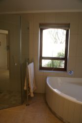 Family bathroom across the passage from 2nd sea-facing bedroom, separate shower, large bath, heated towel rails