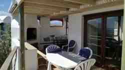Semi-covered section of deck with view over ocean