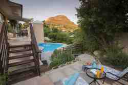 Pool and mountain view from private terrace of self catering suite