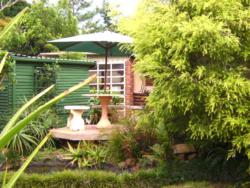 Front garden pond seating area