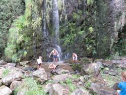Swimming under waterfall