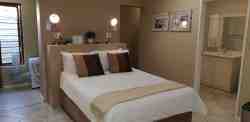 Room 8 is a family room with 2 separate bedrooms with a shower and a bath it has a double bed and 2 single beds 4 people sharing can sleep there