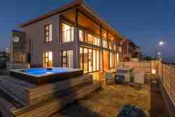Outdoors with spacious Jacuzzi and built-in BBQ/braai with full sea views