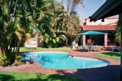 Pool area and outside covered patio and bar