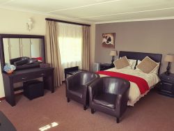 Room 2: Family room with a queen size double bed and 2  single beds. Full en-suite bathroom. Flat screen TV and tea/coffee making facilities are provided.