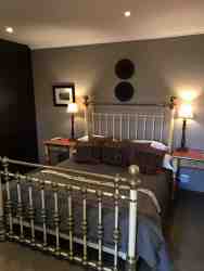 These rooms are elegant and stylish. These suites consist of a queen size bed with bedside tables and reading lamps. The en-suite bathrooms are complete with a shower and/or bath & shower, as well as a comfortable vanity top. The seating areas have comfortable chairs and a writing desk. The rooms are privately accessed from the beautiful shaded gardens, and situated close to the parking areas. Paved walkways lead to the dining room Queens, where breakfast is served in the mornings. 

•	Free WiFi
•	Air Conditioning
•	Electric Blankets in winter
•	Coffee/ Tea making facilities
•	Secure parking
