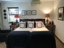 Luxurious and spacious rooms with twin beds, side tables and reading lamps.  These rooms are very close to the parking areas.  The suites are very private and have views of the garden. The rooms are beautifully decorated with an interesting collection of art that grace the walls. The en-suite bathrooms have a bath and/or a shower & bath, and the basins are fitted into spacious vanity tops. These suites have comfortable seating areas, as well as a writing desk.
•	Free WiFi
•	Air Conditioning
•	Electric Blankets in winter
•	Coffee/ Tea making facilities
•	Secure parking
