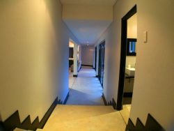 Stairs and passage leading into the villa from the front door