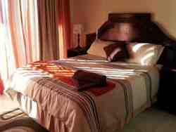 Sea view Room 3 with en-suite bath & shower. Patio.
