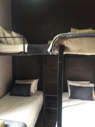 The third bedroom has two custom made adult bunk-beds in it