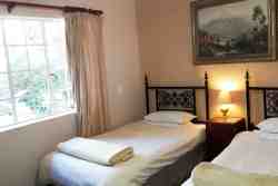 Sharing room - All of our rooms boast fans, heaters, tea and coffee facilities as well as garden views