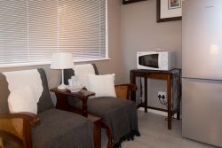 Shared Sitting Room - Wooden Chest & Tin Cup