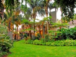 The lush gardens create a tranquil and peaceful setting