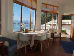Sunny enclosed patio room with access to Jacuzzi, pool and garden from 2 sides.