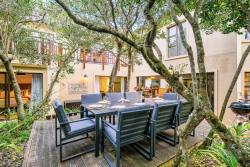 Outdoor dining with has BBQ and wood fired hot tub