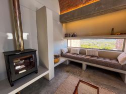 The Hare unit: lounge with fireplace and reading nook