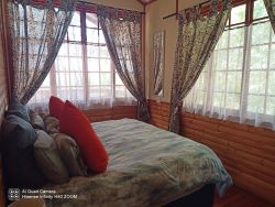 Sunbird cottage separate bedroom with King size bed